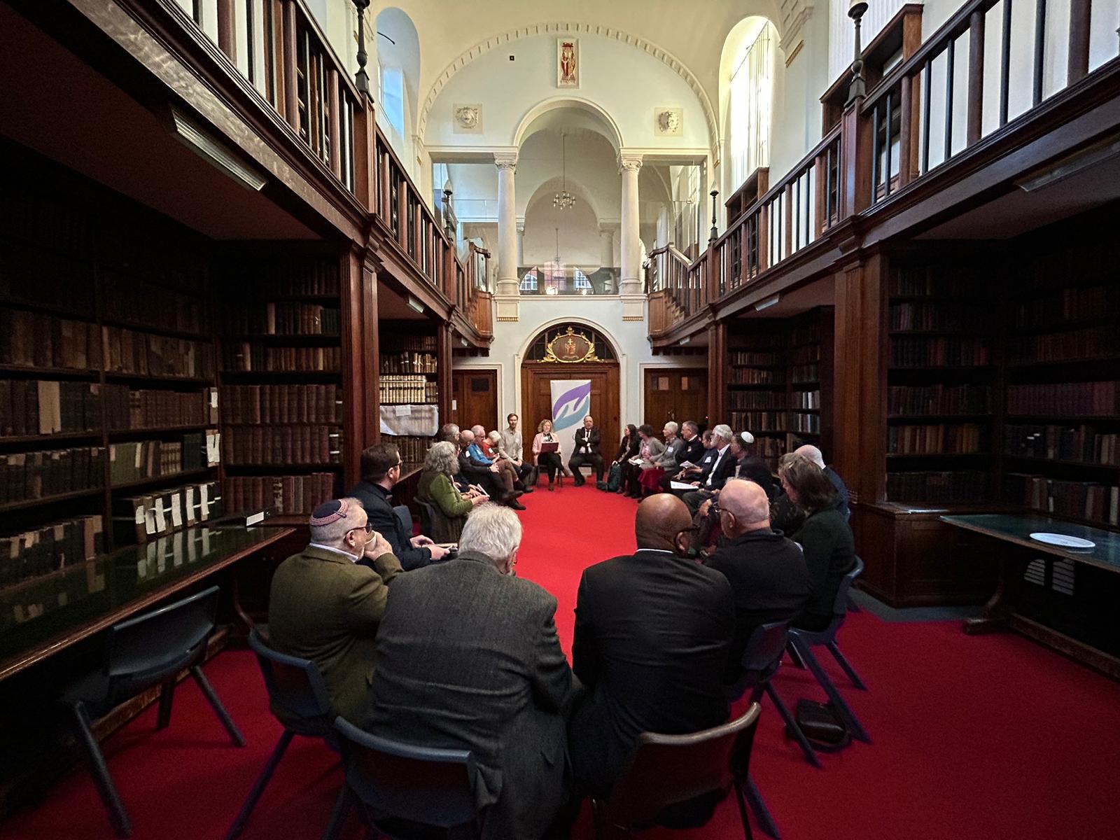 A group shot of the CCJ Conference attendees. The participants are sat in an oval shape, with HIAS+JCORE's Executive Director David Mason sat at the far side.