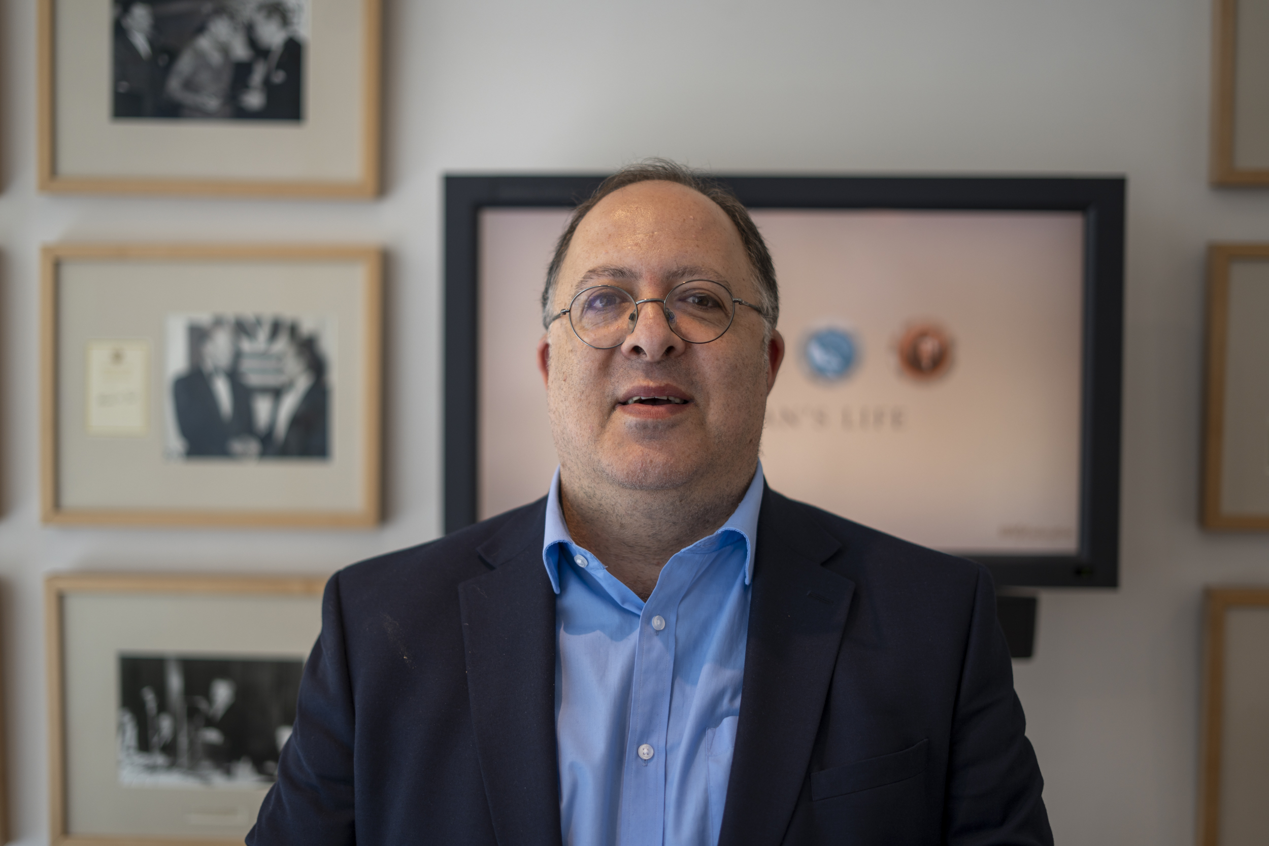 Portrait of David Mason, HIAS+JCORE's Executive Director. David is wearing a blue shirt and dark blue suit jacket.